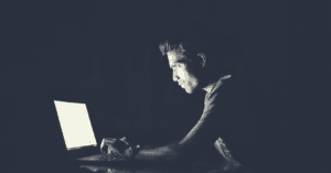 A computer hacker with a laptop.
